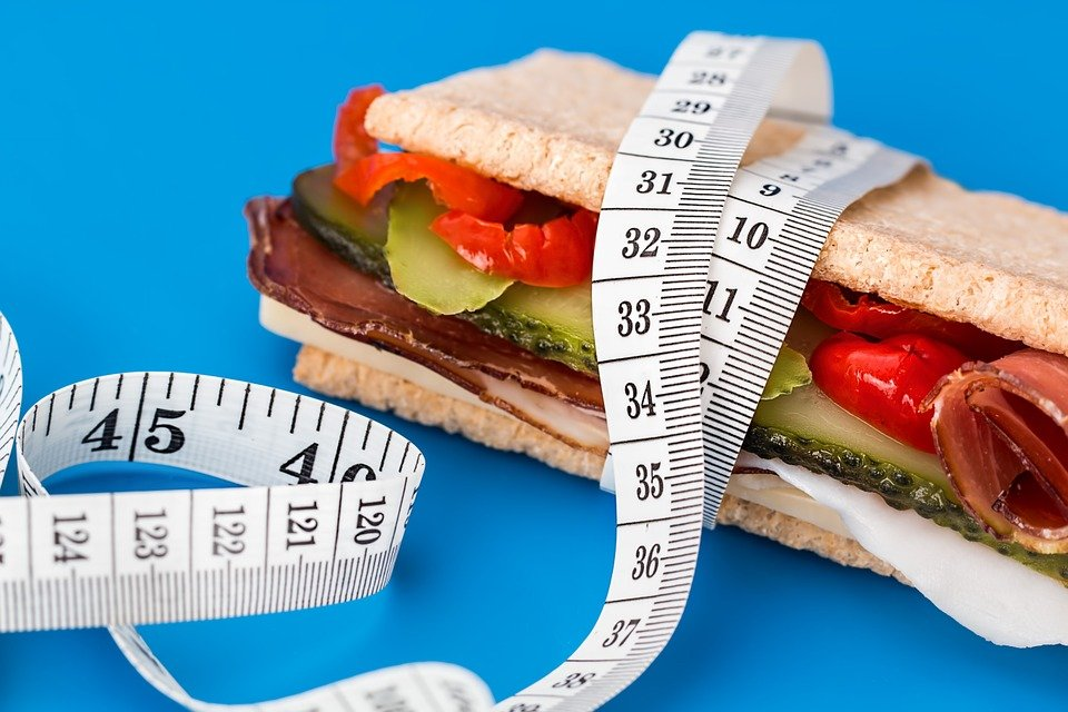 A Measuring Tape Wrapped Around a Healthy Sandwich